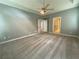 Spacious bedroom with carpet flooring and access to hallway and bathroom at 617 Vinings Estates Se Dr, Mableton, GA 30126