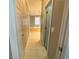 Clean hallway with tile flooring leading to a large bathroom at 617 Vinings Estates Se Dr, Mableton, GA 30126