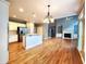 Open concept kitchen with breakfast bar, hardwood floors, and recessed lighting at 617 Vinings Estates Se Dr, Mableton, GA 30126