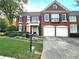 Brick two-story home with two-car garage, balcony, and landscaping at 617 Vinings Estates Se Dr, Mableton, GA 30126