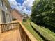 Wooden deck overlooking backyard with privacy hedge at 617 Vinings Estates Se Dr, Mableton, GA 30126