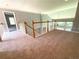 Loft overlooking the main living area, offering extra space and natural light at 617 Vinings Estates Se Dr, Mableton, GA 30126