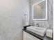 Modern powder room with floating vanity and LED mirror at 2444 Ballantrae Cir, Cumming, GA 30041