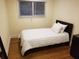 Small bedroom with hardwood floors and a twin bed at 2121 Arlington Ne Ave, Atlanta, GA 30324