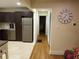 Bright hallway with hardwood floors leading to bedrooms at 2121 Arlington Ne Ave, Atlanta, GA 30324