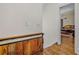 Hallway with hardwood floors and view of living room at 1831 Highway 92, Fayetteville, GA 30215