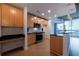 Modern kitchen with wood cabinets, stainless steel appliances and granite countertop at 400 W Peachtree Nw St # 2314, Atlanta, GA 30308