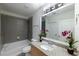 Updated bathroom with granite countertop, tiled shower, and tub at 400 W Peachtree Nw St # 2314, Atlanta, GA 30308
