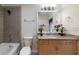 Modern bathroom with granite vanity and tiled shower at 400 W Peachtree Nw St # 2314, Atlanta, GA 30308