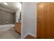 Clean bathroom with a tub, shower, and wood vanity at 400 W Peachtree Nw St # 2314, Atlanta, GA 30308