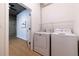Laundry room with washer, dryer, and extra shelving at 400 W Peachtree Nw St # 2314, Atlanta, GA 30308