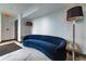 Relaxing lounge with a comfortable blue sofa and floor lamp at 400 W Peachtree Nw St # 2314, Atlanta, GA 30308