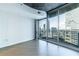 Living room with hardwood floors and floor to ceiling windows at 400 W Peachtree Nw St # 2314, Atlanta, GA 30308