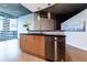Modern kitchen with island, stainless steel appliances, and city view at 400 W Peachtree Nw St # 2314, Atlanta, GA 30308