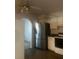 Kitchen features stainless steel refrigerator and white cabinets at 4356 Housworth Dr, Stonecrest, GA 30038