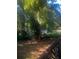 Wooded backyard with shed and a partially visible fence at 4356 Housworth Dr, Stonecrest, GA 30038