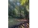 Wooded backyard with a deck and lush greenery at 4356 Housworth Dr, Stonecrest, GA 30038