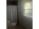 Clean bathroom with shower, toilet and window at 4356 Housworth Dr, Stonecrest, GA 30038