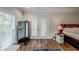 Main bedroom with hardwood floors and access to a private deck at 158 Watkins Glen Dr, Mcdonough, GA 30252