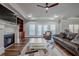 Large living room with hardwood floors, fireplace, and access to a patio at 158 Watkins Glen Dr, Mcdonough, GA 30252