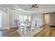 Bright dining room featuring hardwood floors and a charming table setting at 158 Watkins Glen Dr, Mcdonough, GA 30252