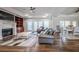 Open living space featuring hardwood floors and a fireplace at 158 Watkins Glen Dr, Mcdonough, GA 30252