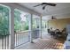Covered deck with seating area and views of the backyard at 158 Watkins Glen Dr, Mcdonough, GA 30252