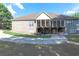 Home's back features a large deck and a spacious yard at 158 Watkins Glen Dr, Mcdonough, GA 30252