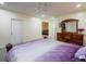 Spacious basement bedroom with plush carpeting and a large dresser at 158 Watkins Glen Dr, Mcdonough, GA 30252