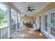 Spacious deck with seating area, ceiling fans, and access from multiple rooms at 158 Watkins Glen Dr, Mcdonough, GA 30252