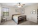 Cozy bedroom with a double bed, window, and ceiling fan at 510 Church St, Buford, GA 30518