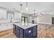 Modern kitchen with a blue island and stainless steel appliances at , Covington, GA 30014