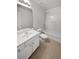 Bathroom with tub shower, single vanity, and tile flooring at 709 Celeste Sw Ln, Atlanta, GA 30331