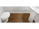 Simple half bathroom with pedestal sink and wood-look flooring at 709 Celeste Sw Ln, Atlanta, GA 30331
