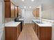 Bright kitchen with wood cabinets and laminate flooring at 709 Celeste Sw Ln, Atlanta, GA 30331