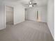 Large main bedroom with plush carpet and walk-in closet at 709 Celeste Sw Ln, Atlanta, GA 30331