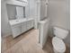 Double vanity bathroom with neutral tile flooring at 709 Celeste Sw Ln, Atlanta, GA 30331