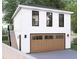 Two-story garage with a large door, upper-level windows, and an attached staircase at 474 Eastland Dr, Decatur, GA 30030