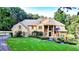 Stunning two-story house with a large lawn and mature trees at 2269 E Cherokee Dr, Woodstock, GA 30188