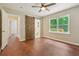Main bedroom with barn door revealing en suite bathroom and hardwood floors at 1847 Ridgeland Dr, Decatur, GA 30032