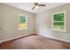 Spacious bedroom featuring hardwood floors and dual windows at 1847 Ridgeland Dr, Decatur, GA 30032