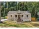 Brick house with brown door, steps, and a landscaped yard at 1847 Ridgeland Dr, Decatur, GA 30032