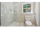 Updated bathroom with marble shower and modern fixtures at 1847 Ridgeland Dr, Decatur, GA 30032