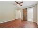 Main bedroom with barn door entry to ensuite bathroom and hardwood floors at 1847 Ridgeland Dr, Decatur, GA 30032