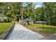 House with a driveway and a stone retaining wall at 1847 Ridgeland Dr, Decatur, GA 30032