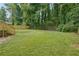 Spacious backyard with fenced in area and grass at 1847 Ridgeland Dr, Decatur, GA 30032