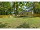 Backyard with deck, stone path, and fenced yard at 1847 Ridgeland Dr, Decatur, GA 30032