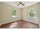 Bright bedroom with hardwood floors and ceiling fan at 1847 Ridgeland Dr, Decatur, GA 30032