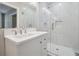 Modern bathroom with white vanity and marble shower at 1847 Ridgeland Dr, Decatur, GA 30032