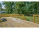 New deck with wood railings and backyard view at 1847 Ridgeland Dr, Decatur, GA 30032